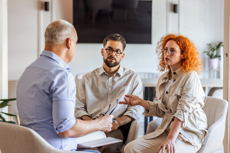 couple in a discussion with a mediator